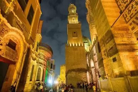 Cairo tower and Moez street by night